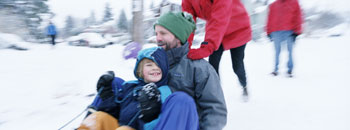 Family Playing in Winter Snow, Washington State, USA